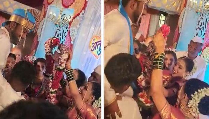 পাত্রকে বিয়ের মালা পরাচ্ছেন যমজ দুই বোন।