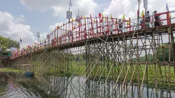 দীর্ঘ দুর্ভোগ কমাতে ধলেশ্বরীর বুকে বাঁশের ২৪০ ফুট সেতু